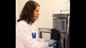 Researcher prepairing a mass spectrometric analysis.